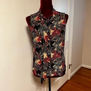 Trina Turk blouse with sash, hidden buttons.